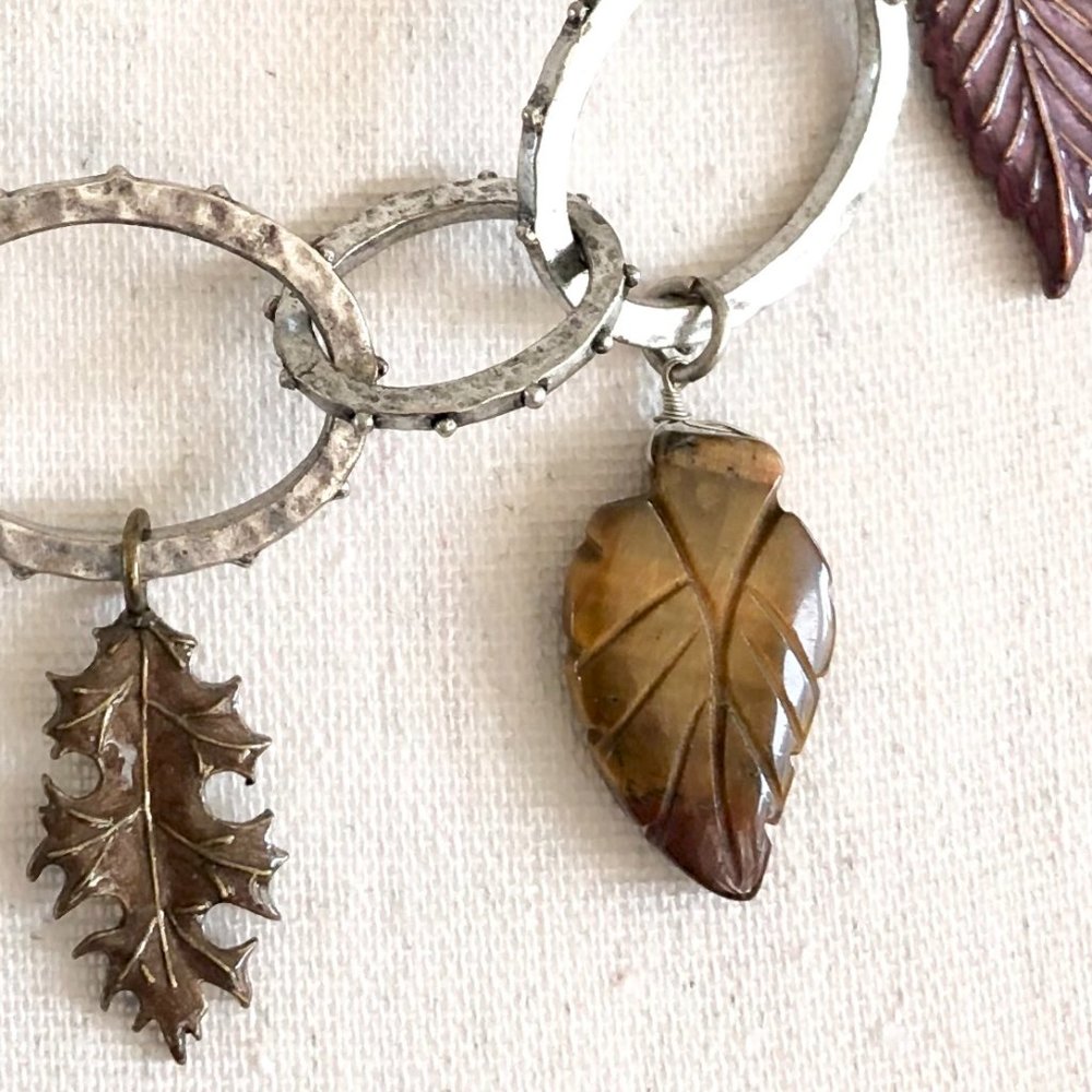 Carved stone and enamel leaf necklace